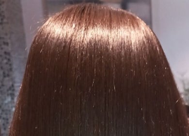 Smooth, shiny hair styled at Miss J'z Hair and Beauty Bar, Cape Town, Western Cape, ZA.