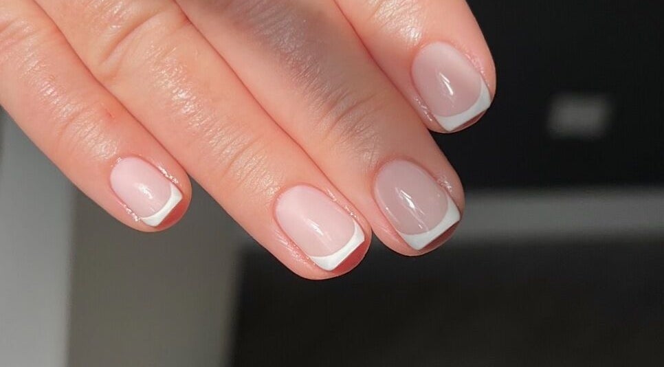 Stylish French manicure by By Christy F in Clydebank, Scotland, GB, showcasing elegant nail art design.