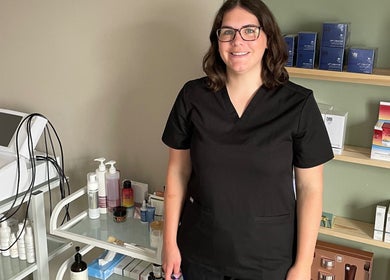 Professional at The Skin Corner by Amy in Shaftesbury, England showcasing skincare products and tools.