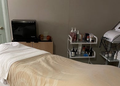 Relaxing spa room at The Skin Corner by Amy, Shaftesbury, England, GB showcasing treatment bed and equipment.