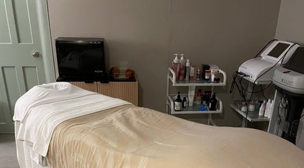 Relaxing spa room at The Skin Corner by Amy, Shaftesbury, England, GB showcasing treatment bed and equipment.