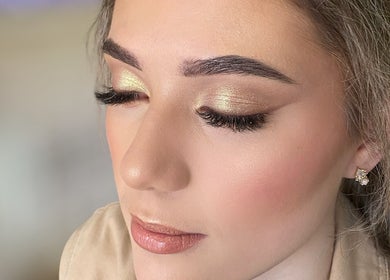 Close-up of a woman's glamorous makeup with golden eyeshadow at Luca Beauty, Potchefstroom, North West, ZA.
