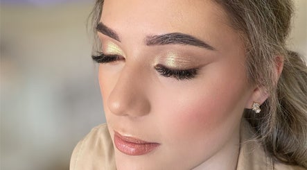 Close-up of a woman's glamorous makeup with golden eyeshadow at Luca Beauty, Potchefstroom, North West, ZA.