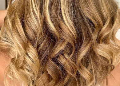 Golden wavy hair styling at Veronica Capri Beauty Salon Sydney, New South Wales, AU.