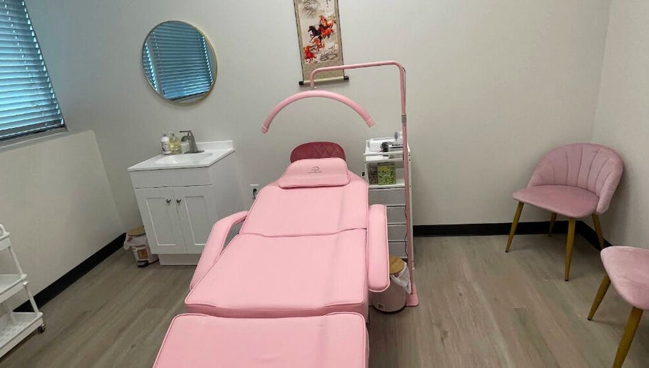 Elegant treatment room at Andrea’s Lashes in West Valley City, Utah, US, featuring a pink reclining chair.
