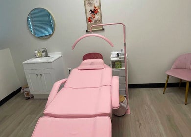 Elegant treatment room at Andrea’s Lashes in West Valley City, Utah, US, featuring a pink reclining chair.