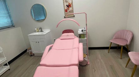 Elegant treatment room at Andrea’s Lashes in West Valley City, Utah, US, featuring a pink reclining chair.