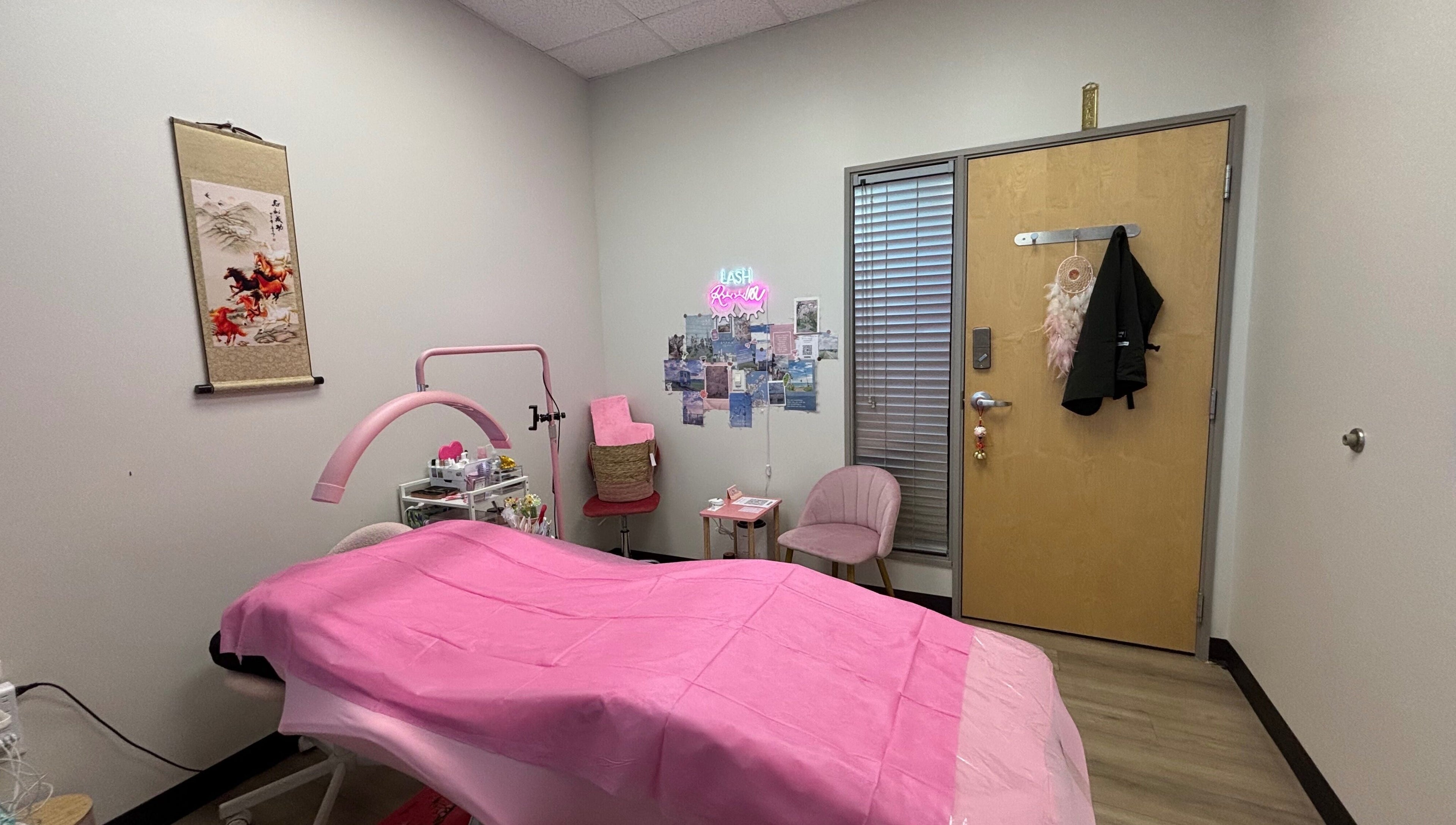 Cozy treatment room at Andrea’s Lashes, West Valley City, Utah, US, with pink decor and relaxing ambiance.