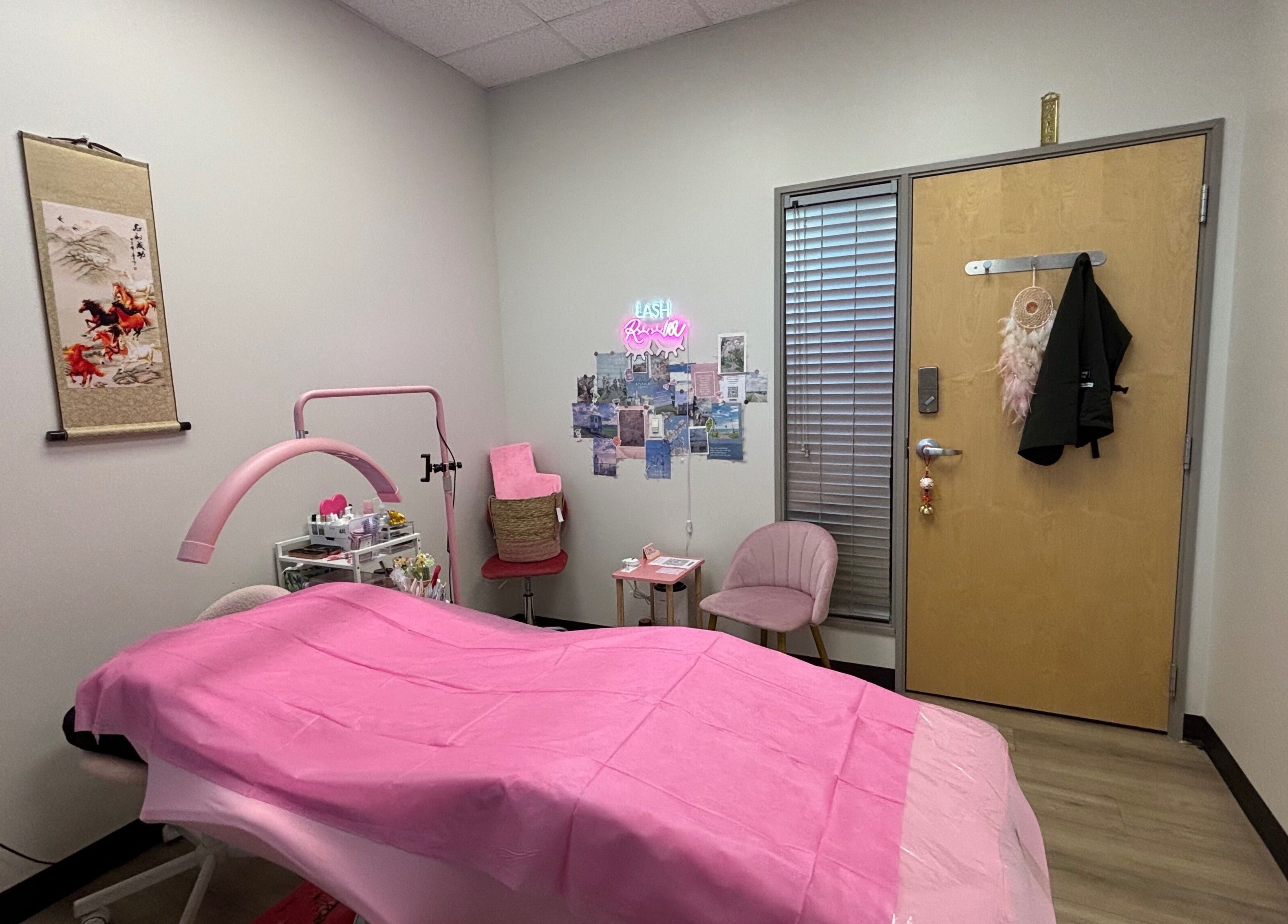 Cozy treatment room at Andrea’s Lashes, West Valley City, Utah, US, with pink decor and relaxing ambiance.