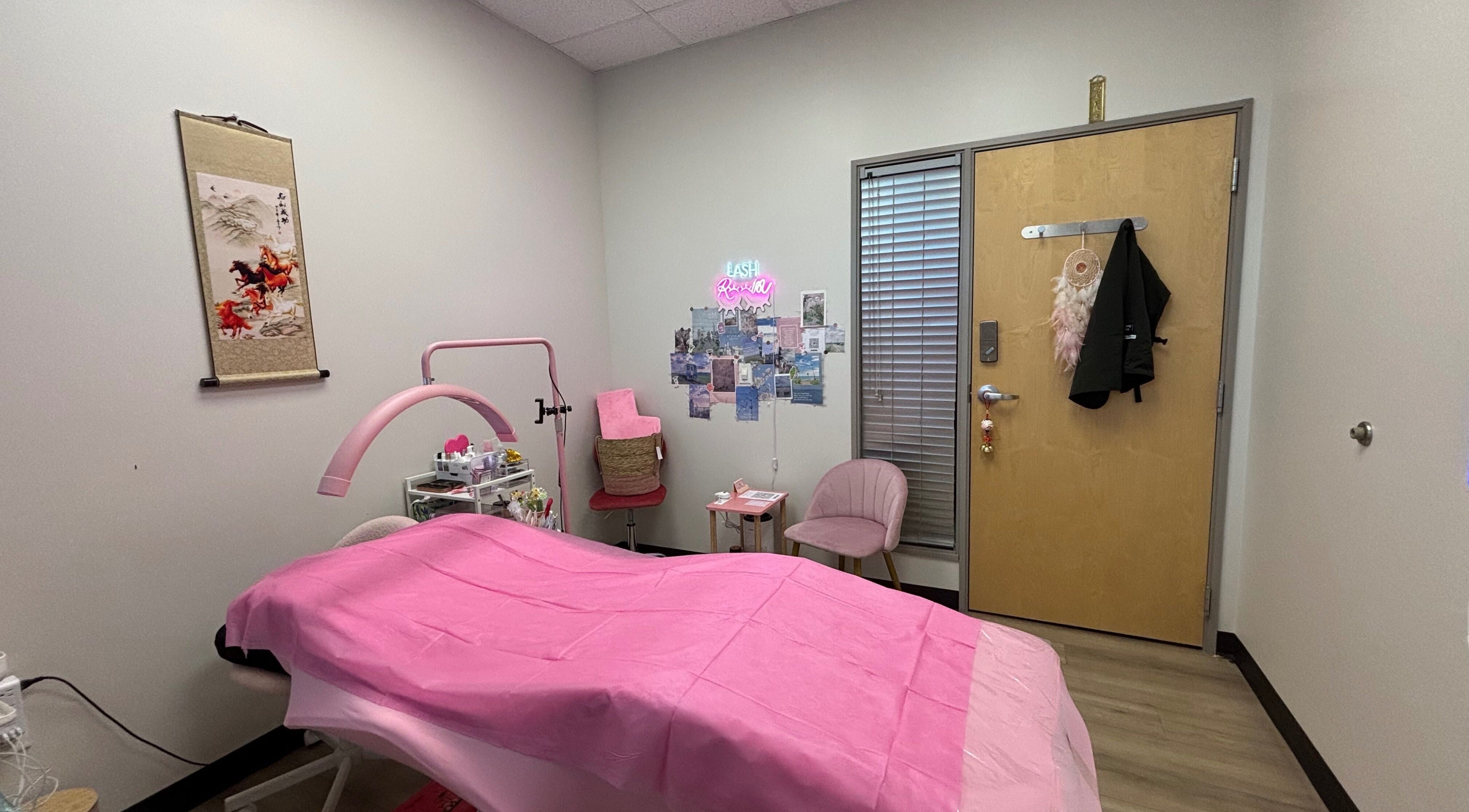 Cozy treatment room at Andrea’s Lashes, West Valley City, Utah, US, with pink decor and relaxing ambiance.