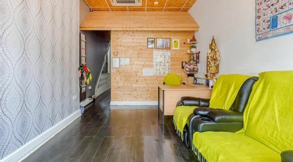 Elegant interior of Kamon Ruean Tai Thai Massage in London, England, GB with soothing decor and seating.