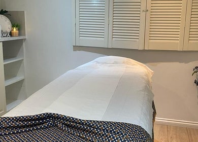 Relaxing massage room at U&I Thai Spa (Inside Elite Nail), London, England, GB, with a cozy treatment bed.