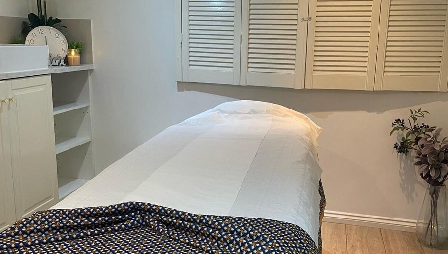 Elegant massage room at U&I Thai Spa, London, England, GB with cozy decor and soft lighting.