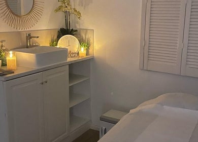 Tranquil massage room at U&I Thai Spa, London, England, GB featuring warm lighting and elegant decor.