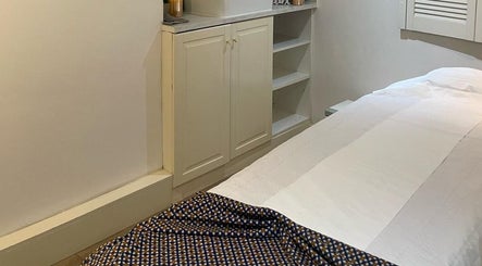 Serene massage room at U&I Thai Spa in London, England, GB with elegant decor and soothing ambiance.