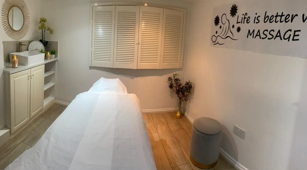 Peaceful massage room at U&I Thai Spa in London, England, GB, with a cozy bed and calming decor.