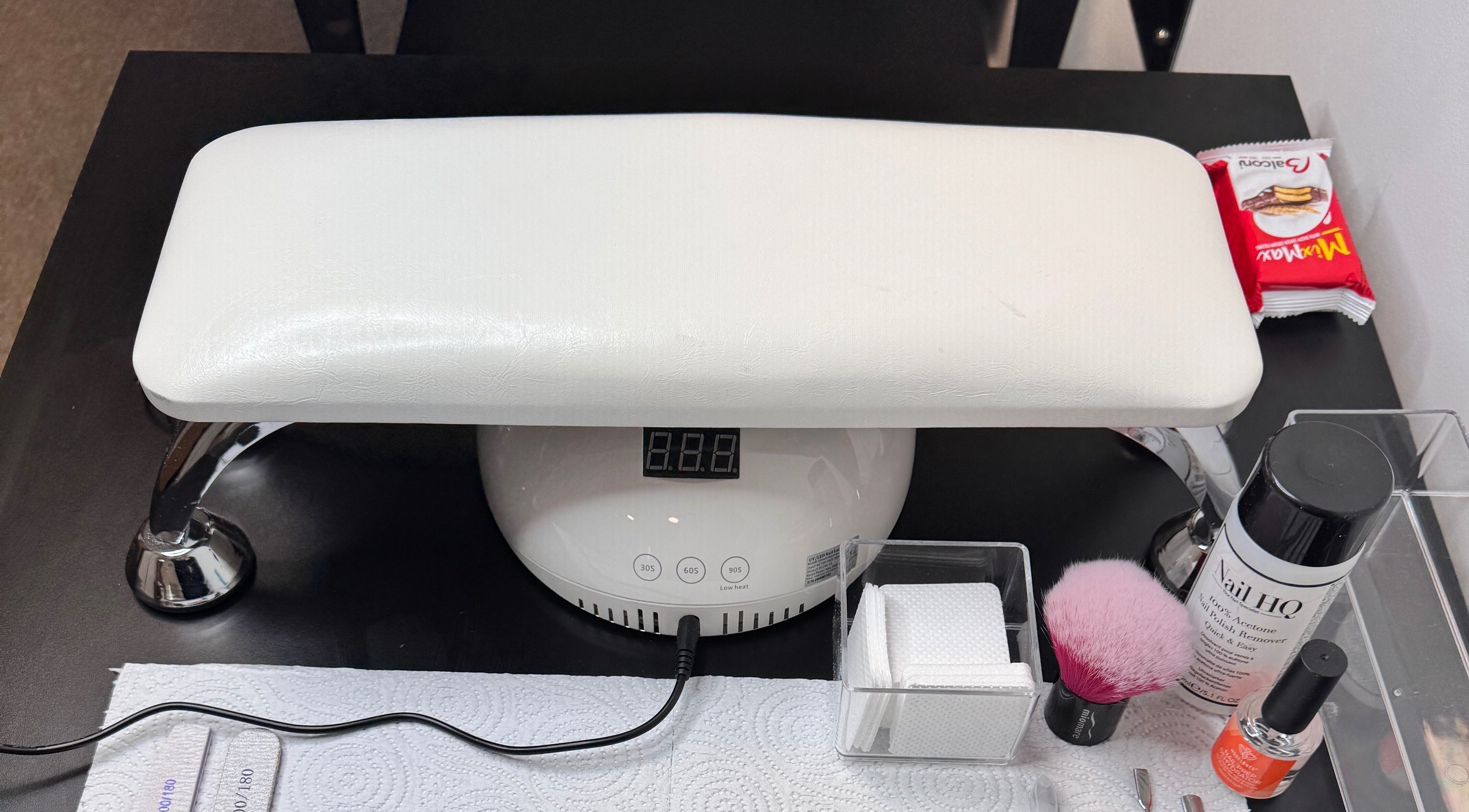 Nail treatment station at Heavenly Aesthetics, Stoke-on-Trent, England, GB, showcasing tools and products.