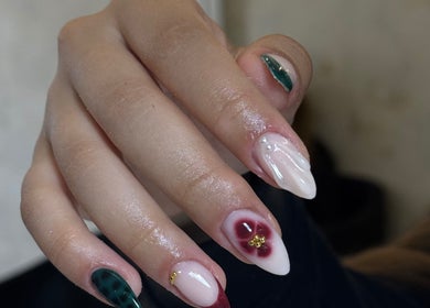 Elegant nail art at Heavenly Aesthetics, Stoke-on-Trent, England, GB. Intricate design with floral accents.