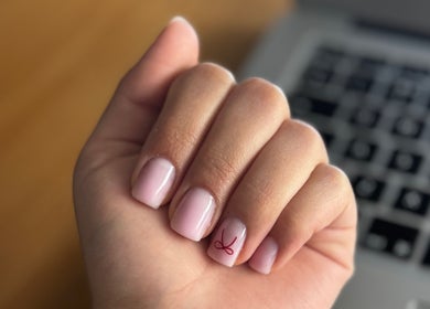 Elegant nail art at Heavenly Aesthetics, Stoke-on-Trent, England. Perfectly manicured hand with subtle design.