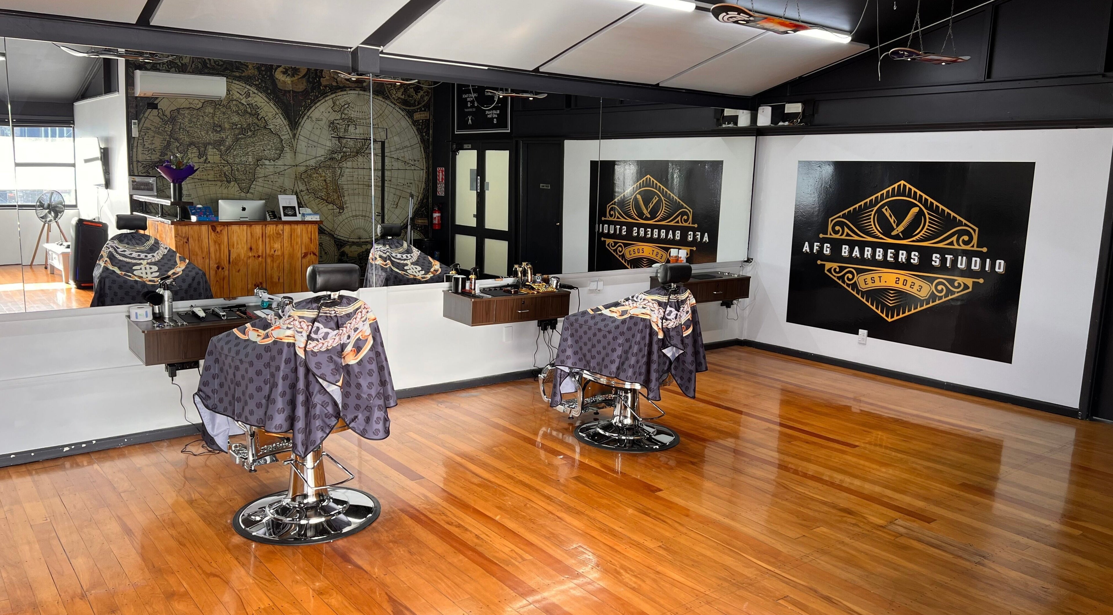 Interior of Afg Barbers Studio in Christchurch, Canterbury, NZ featuring modern barber chairs and stylish decor.