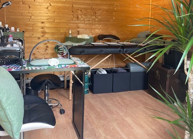 Tranquil beauty room at Green Cabin Beauty, Mill Meadows, Newport, England, GB, featuring lush greenery and modern decor.