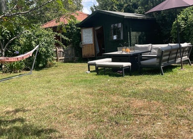 Relaxing garden view with hammock at Green Cabin Beauty at Mill Meadows, Newport, England, GB.
