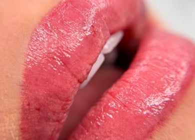 Close-up of glossy lips at Skinart By K in London, England, GB, showcasing expert beauty care.