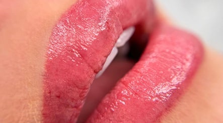 Close-up of glossy lips at Skinart By K in London, England, GB, showcasing expert beauty care.