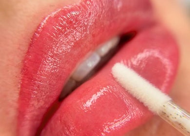Close-up of glossy lips treatment at Skinart By K, London, England, GB.
