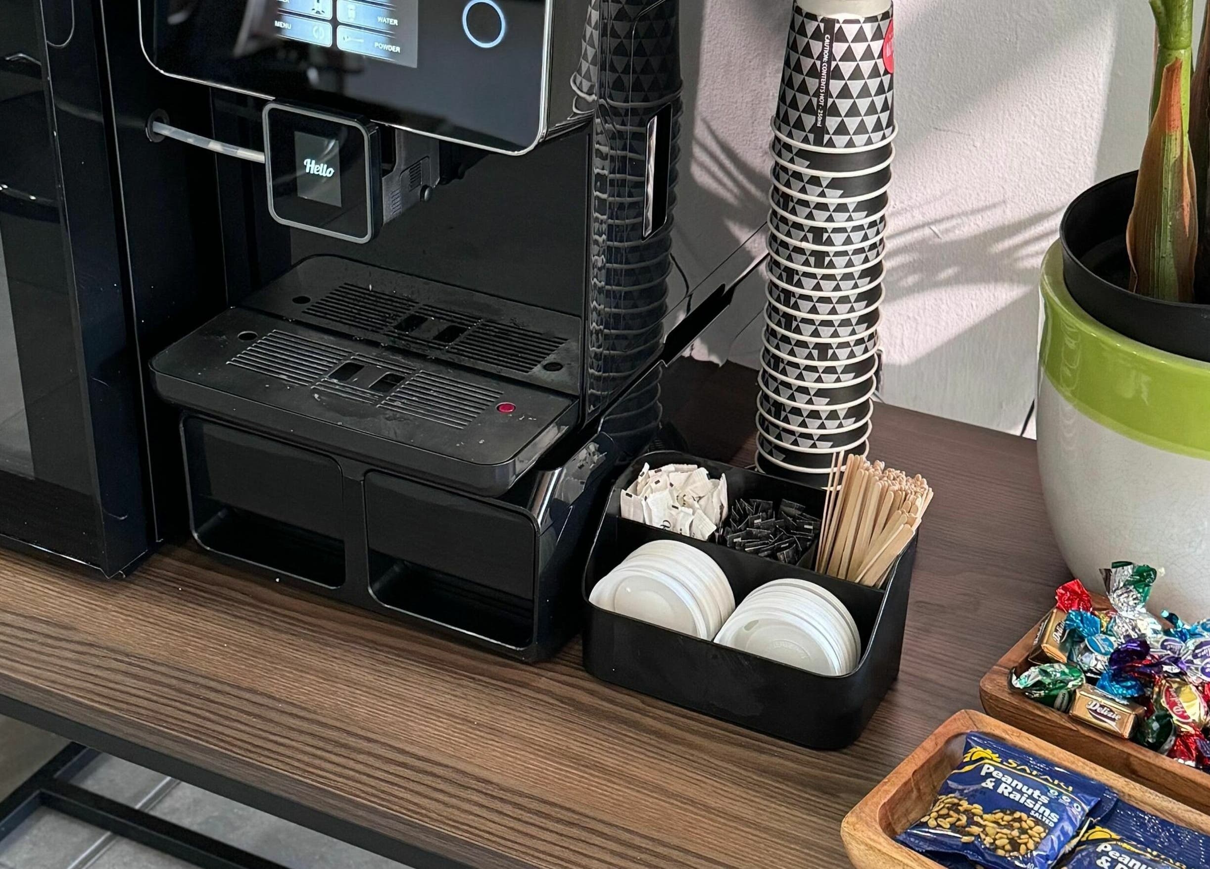 Coffee station at The Old Harbour Barber, Hermanus, Western Cape, ZA with snacks and supplies.