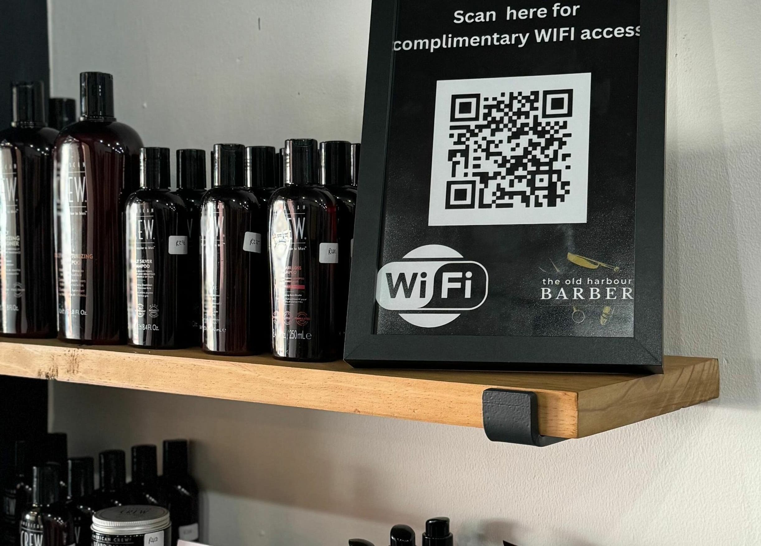 Products and QR code for WiFi at The Old Harbour Barber, Hermanus, Western Cape, ZA.