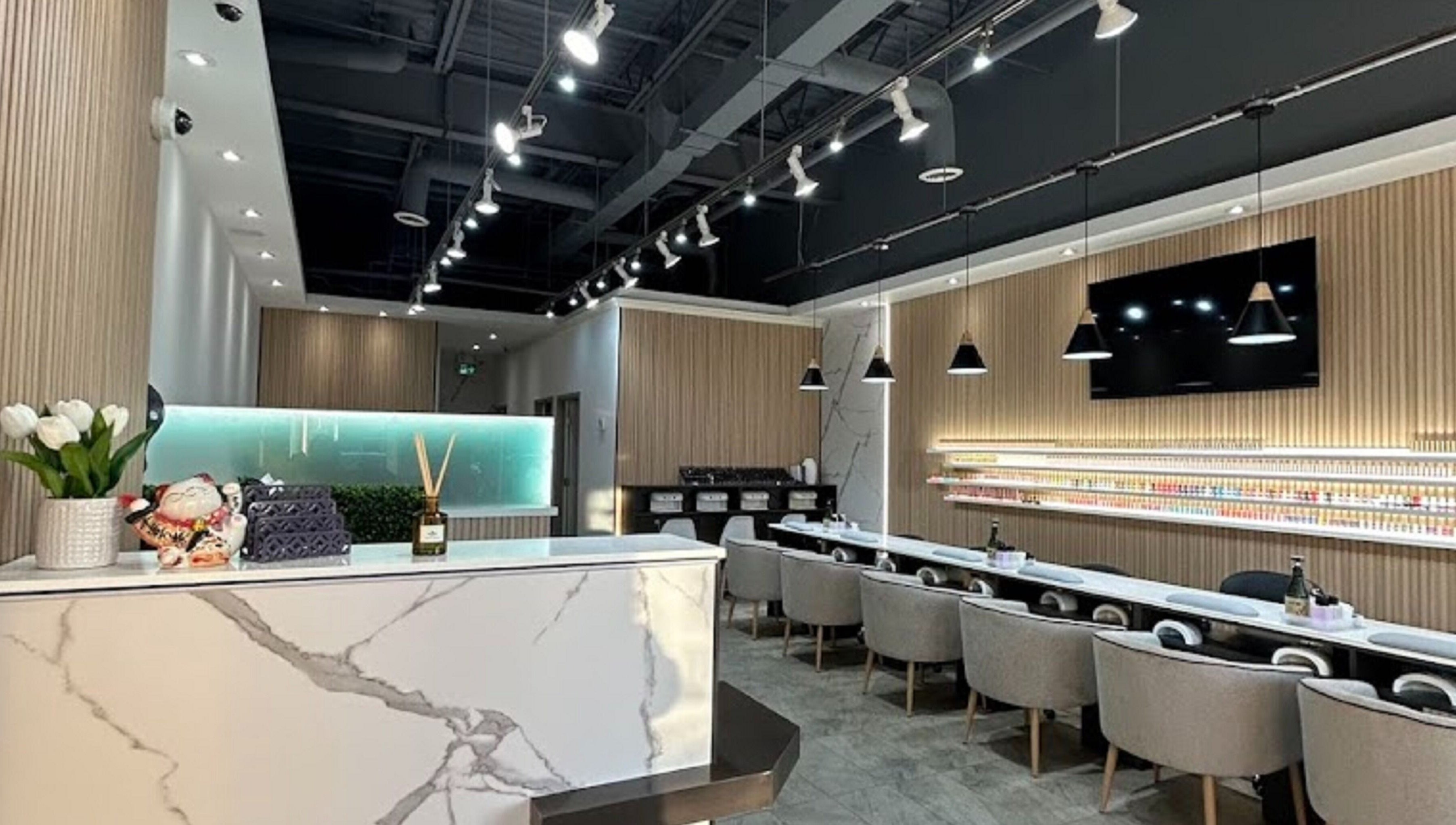 Elegant interior of J P Nail Spa in Vaughan, Ontario, CA featuring modern decor with plush seating.