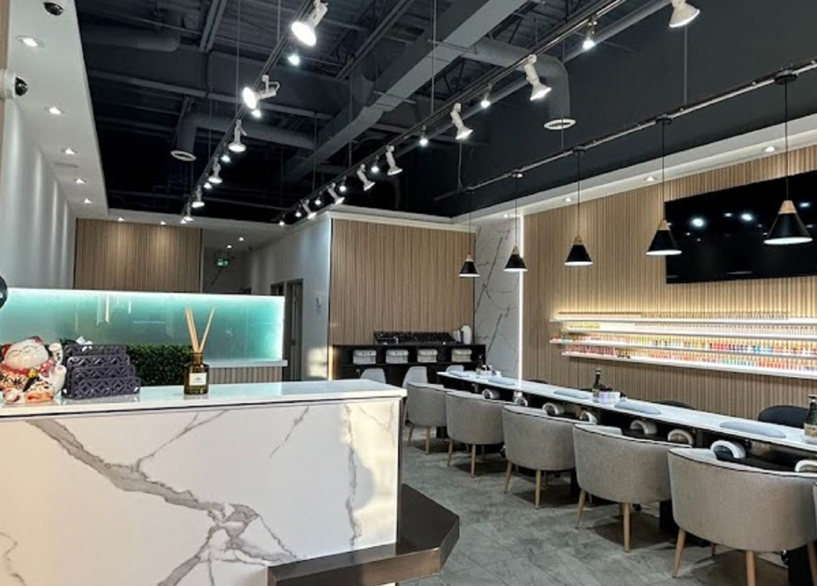 Elegant interior of J P Nail Spa in Vaughan, Ontario, CA featuring modern decor with plush seating.