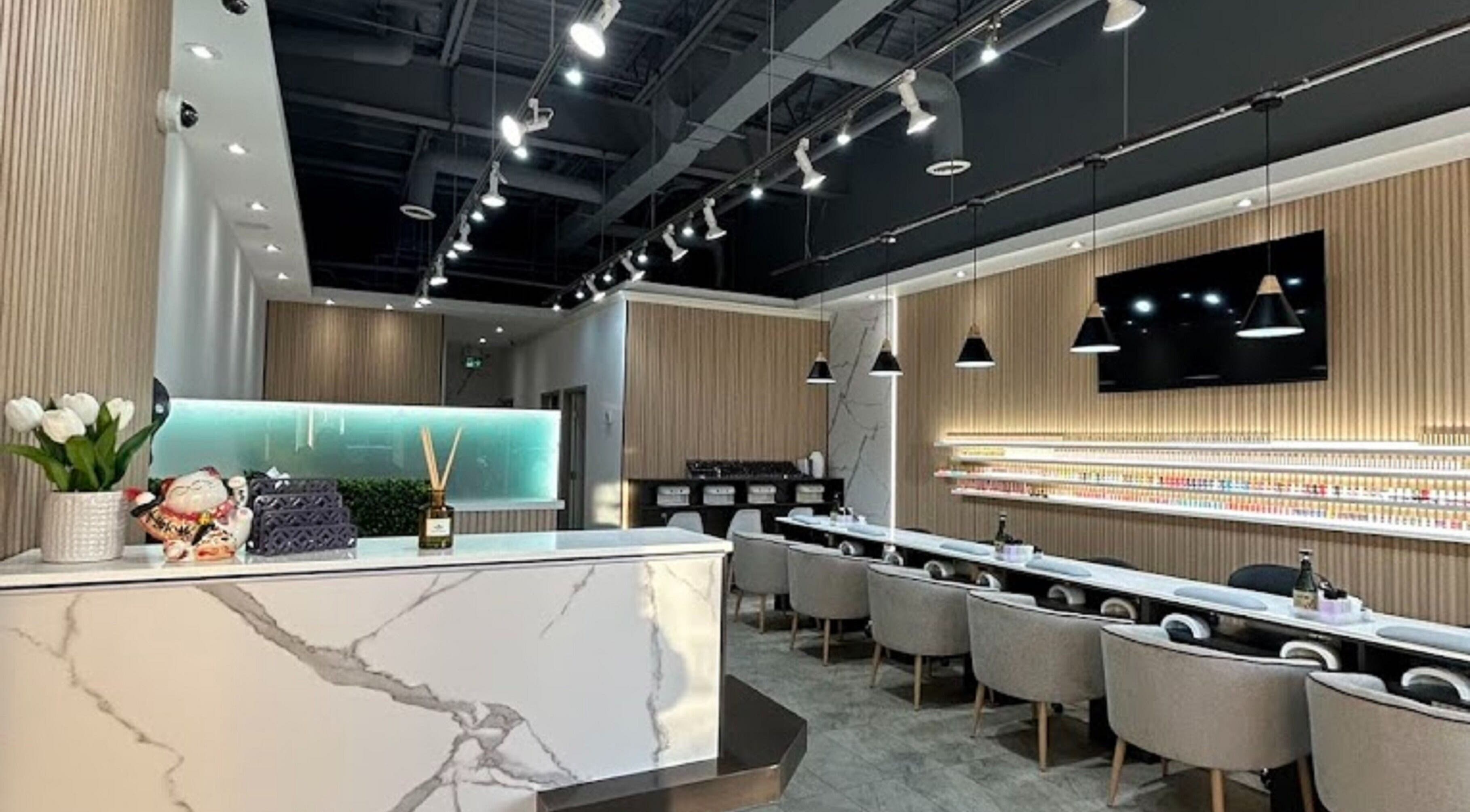 Elegant interior of J P Nail Spa in Vaughan, Ontario, CA featuring modern decor with plush seating.