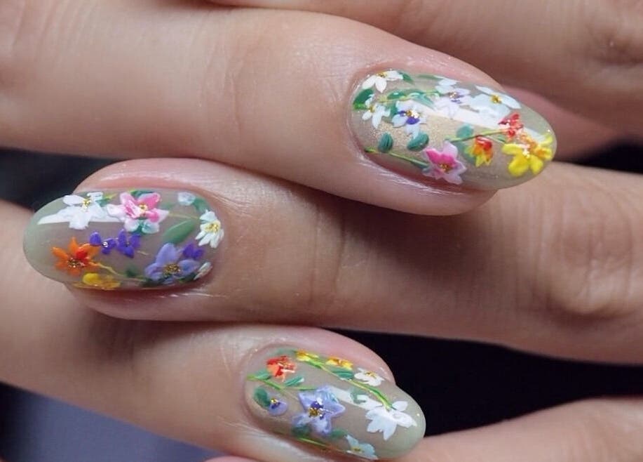 Intricate floral nail art design at J P Nail Spa in Vaughan, Ontario, CA showcasing vibrant, colorful flowers.