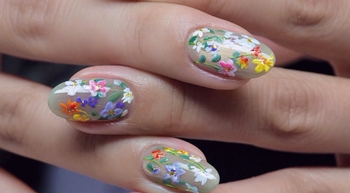 Intricate floral nail art design at J P Nail Spa in Vaughan, Ontario, CA showcasing vibrant, colorful flowers.
