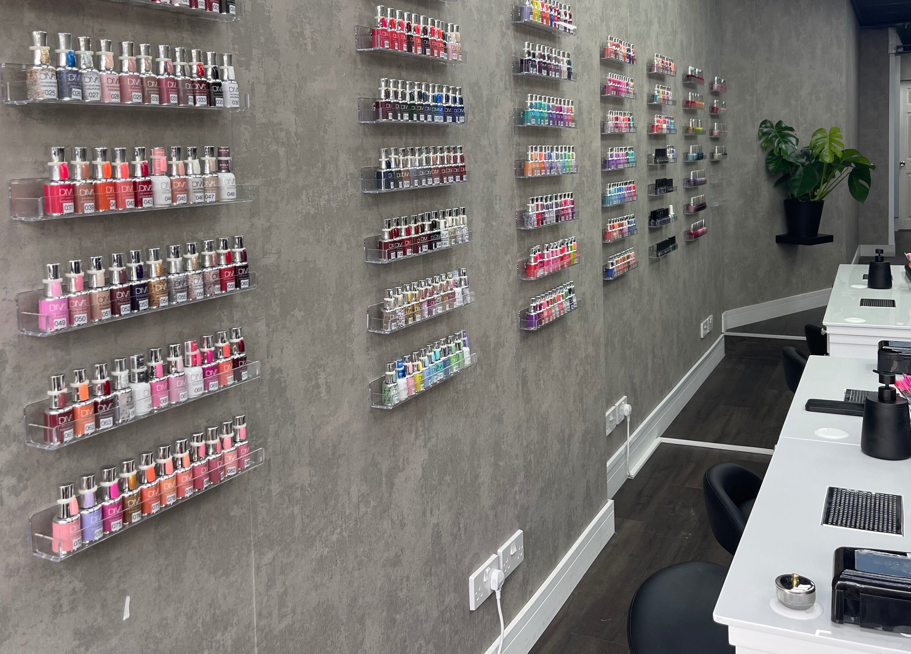 Nail polish display and manicure stations at Black Angel, Cardiff, Wales, GB offering stylish beauty services.