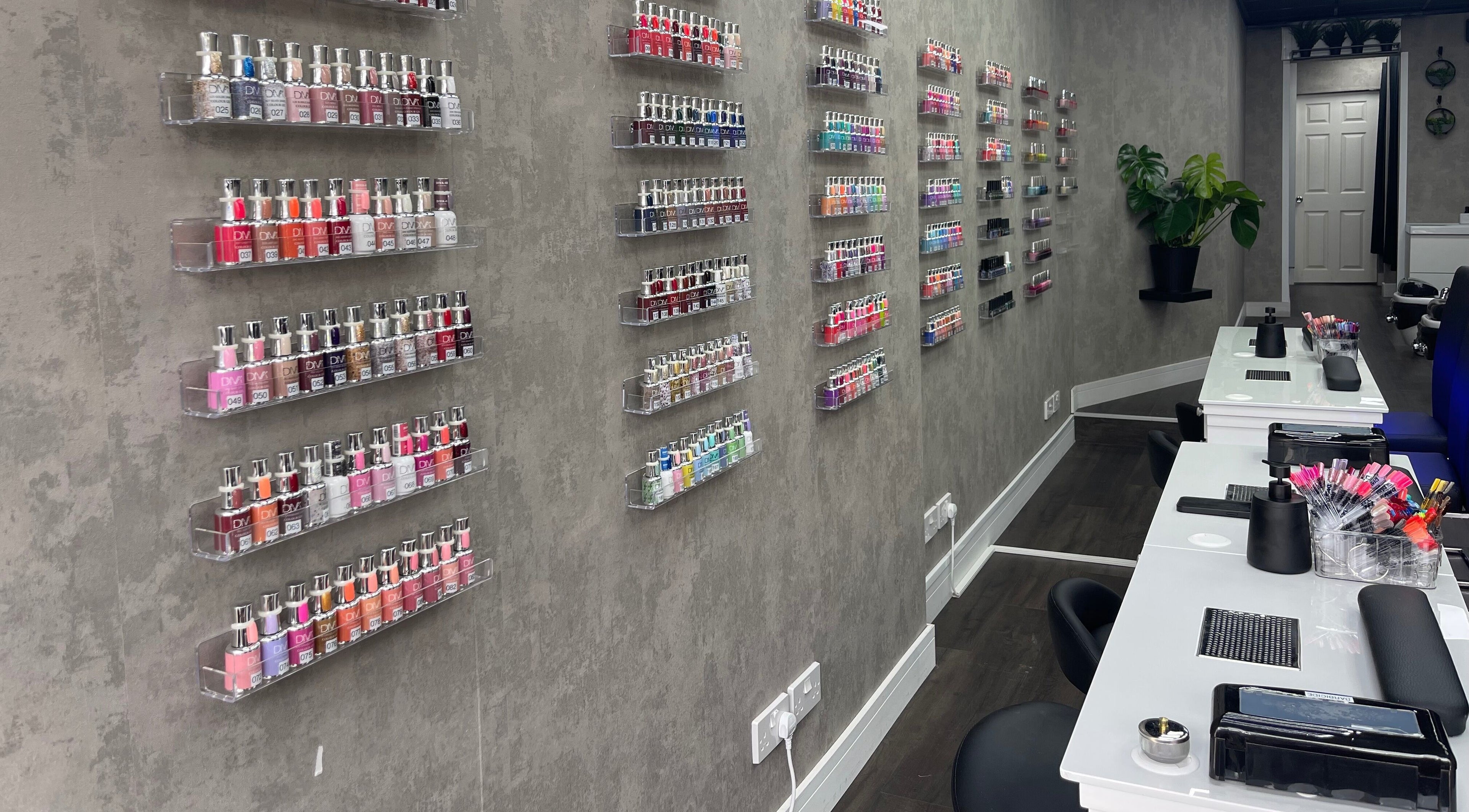 Nail polish display and manicure stations at Black Angel, Cardiff, Wales, GB offering stylish beauty services.