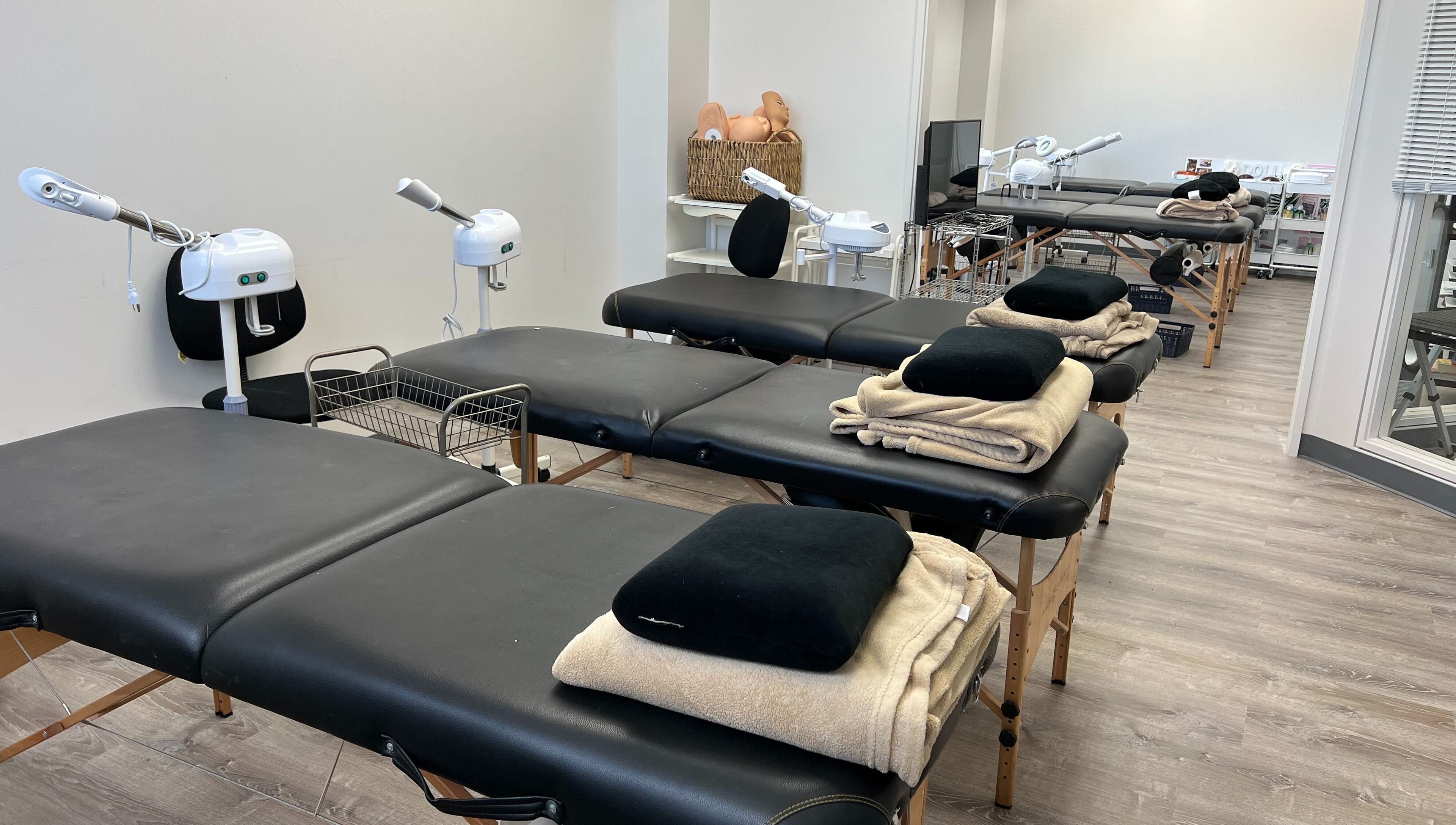 Spacious treatment room at HNA Est Hybrid Online Students in Honolulu, Hawaii, US with multiple massage tables.