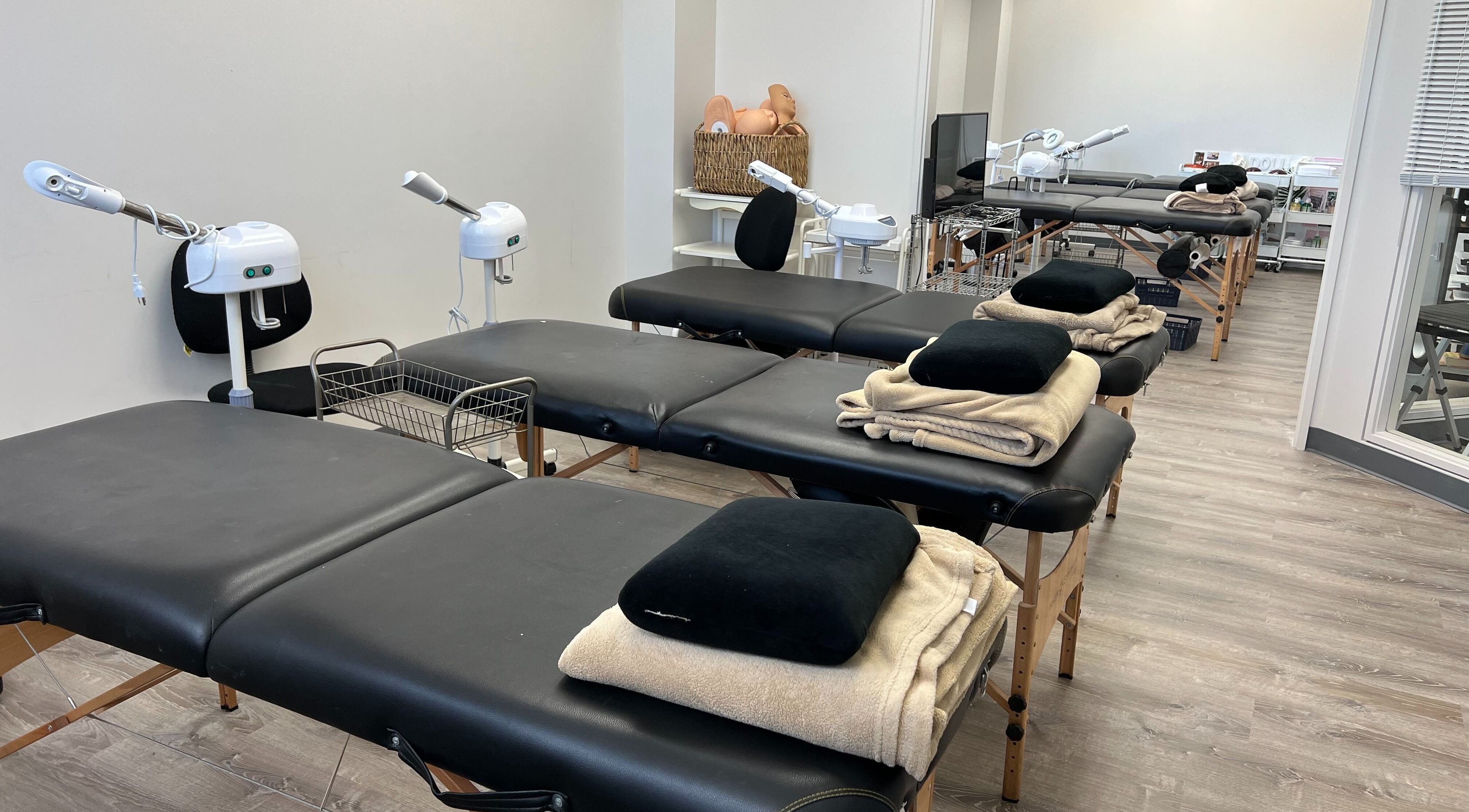 Spacious treatment room at HNA Est Hybrid Online Students in Honolulu, Hawaii, US with multiple massage tables.