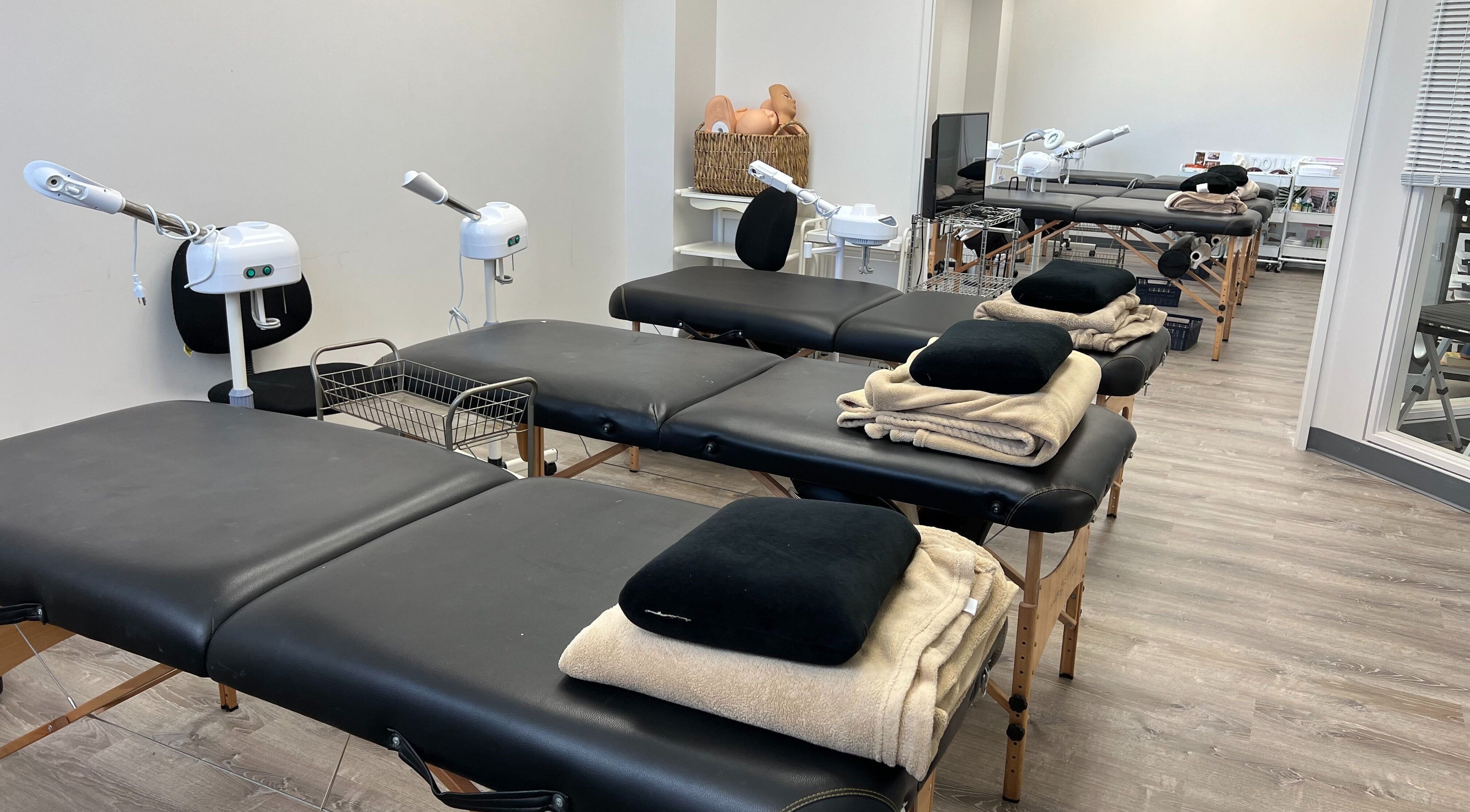 Spacious treatment room at HNA Est Hybrid Online Students in Honolulu, Hawaii, US with multiple massage tables.