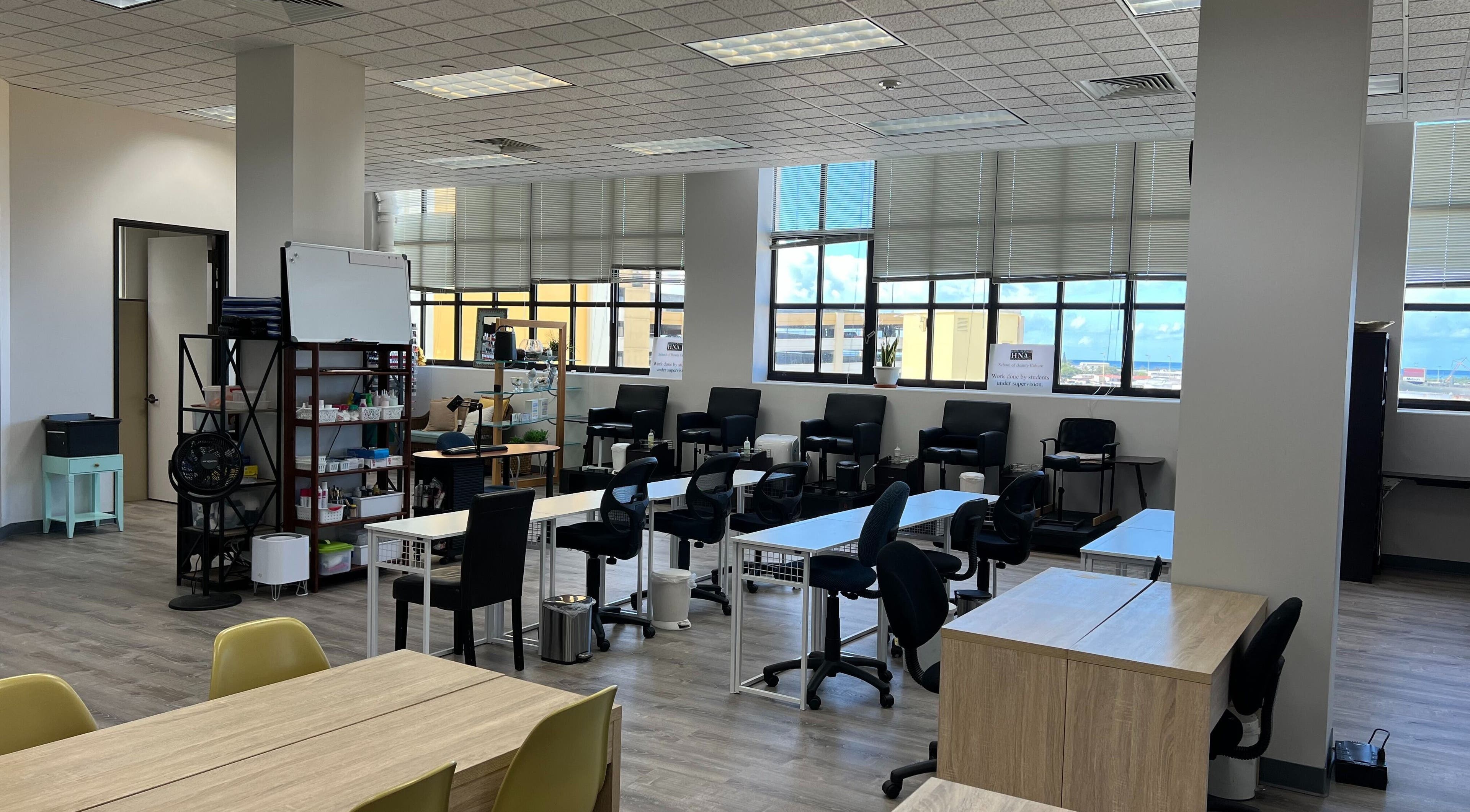 Modern classroom at HNA Est Hybrid Online Students, Honolulu, Hawaii, US with desks and chairs.