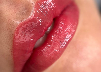 Luscious red lips with gloss at Browow: Brows & Lips That Stay, Melbourne, Victoria, AU.