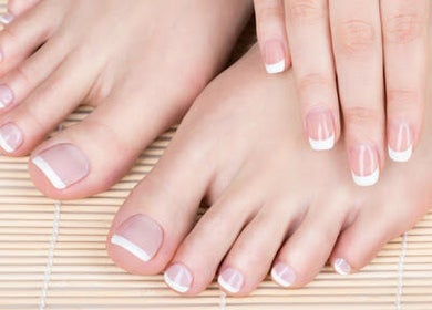 French manicure and pedicure at Marie’s Nail Loft, Bonner Springs, Kansas, US, showcasing elegance.