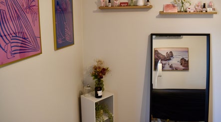 Cozy room at Brookelyn Beauty, Perth, Western Australia, featuring stylish art and decor for a relaxing ambiance.