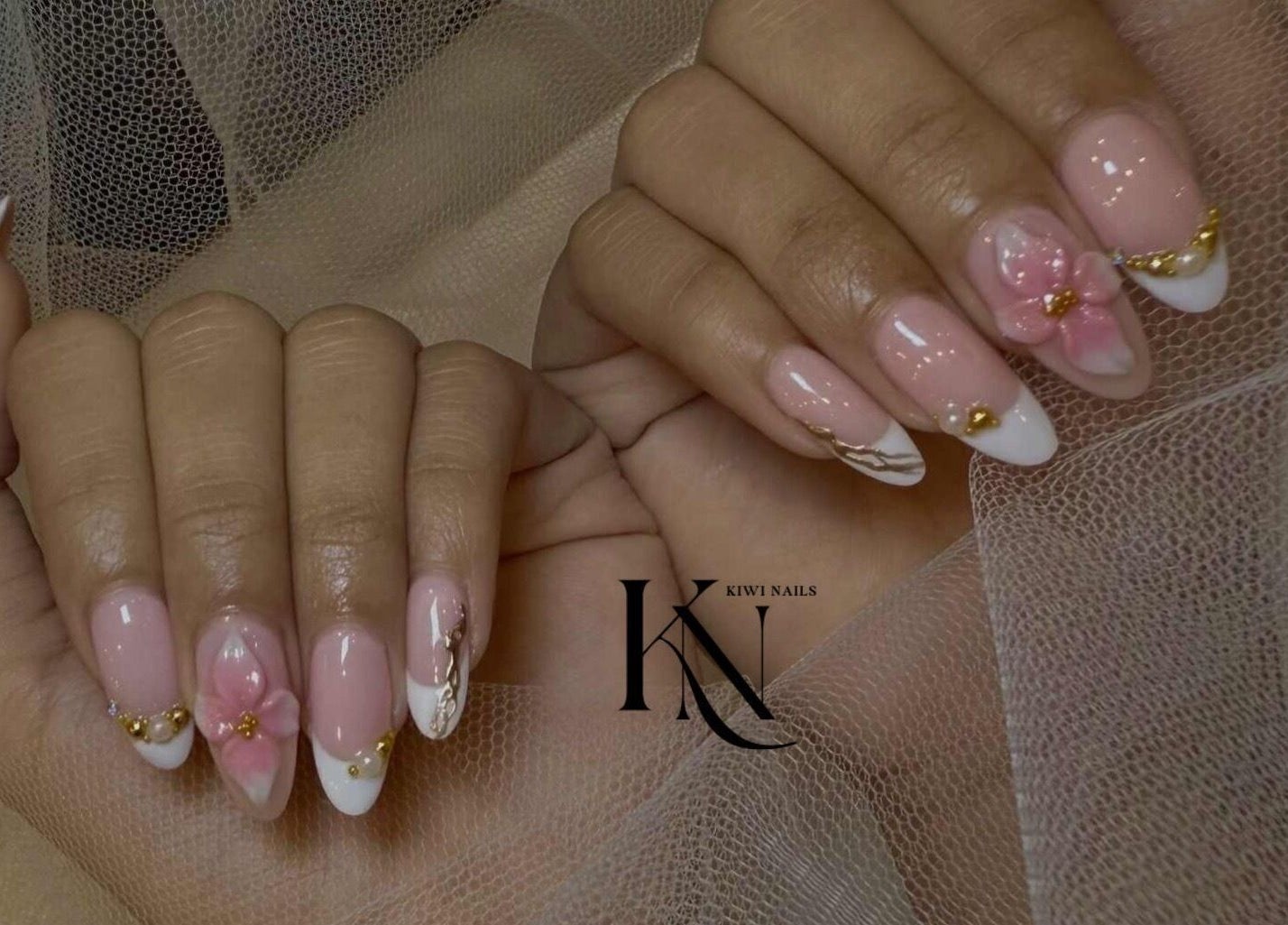 Elegant floral nail art at Kiwi Nails & Spa Milford, Auckland, Auckland, NZ, featuring pink and white designs.