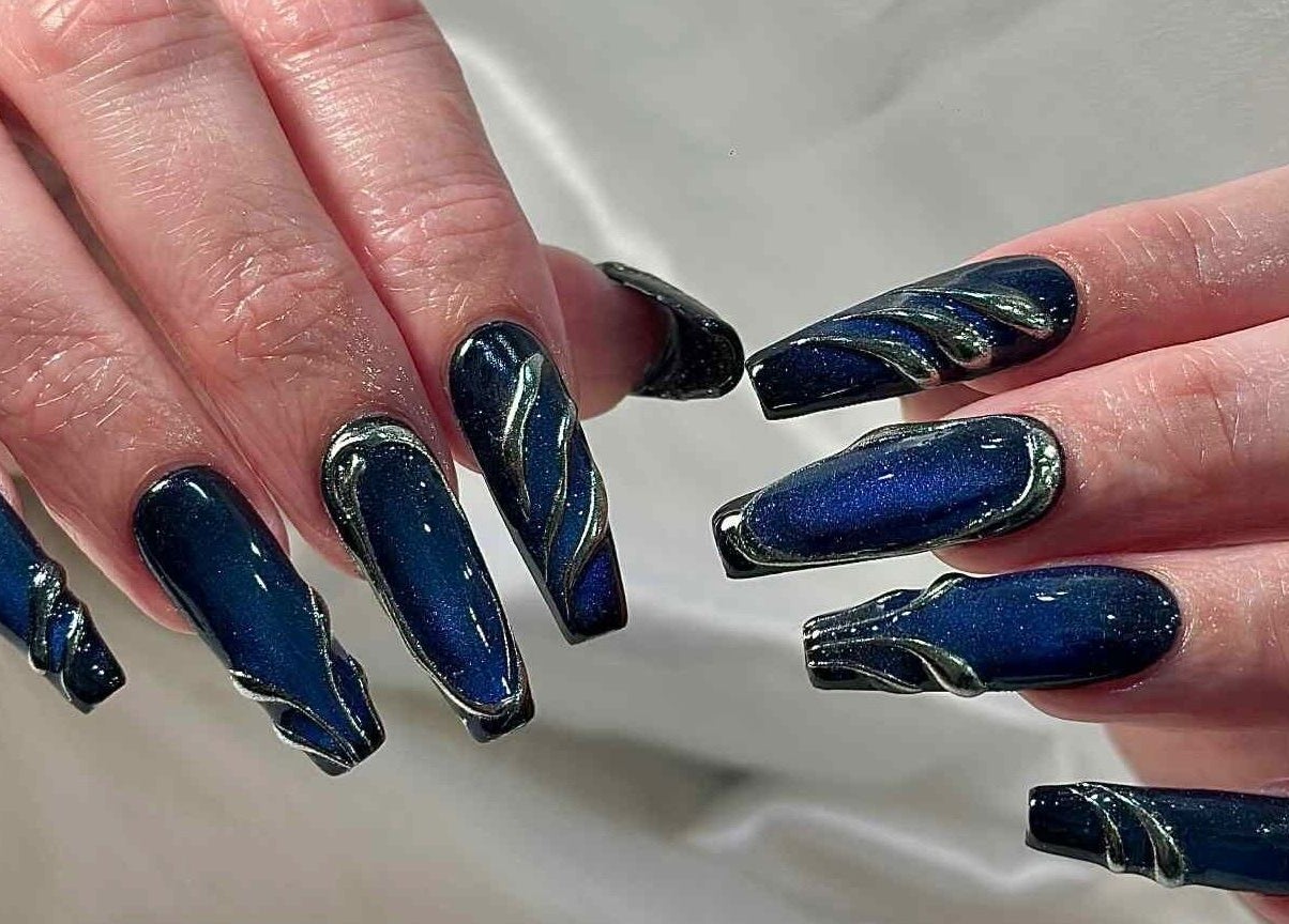 Stylish blue nails with cosmic design at Kiwi Nails & Spa Milford, Auckland, Auckland, NZ.