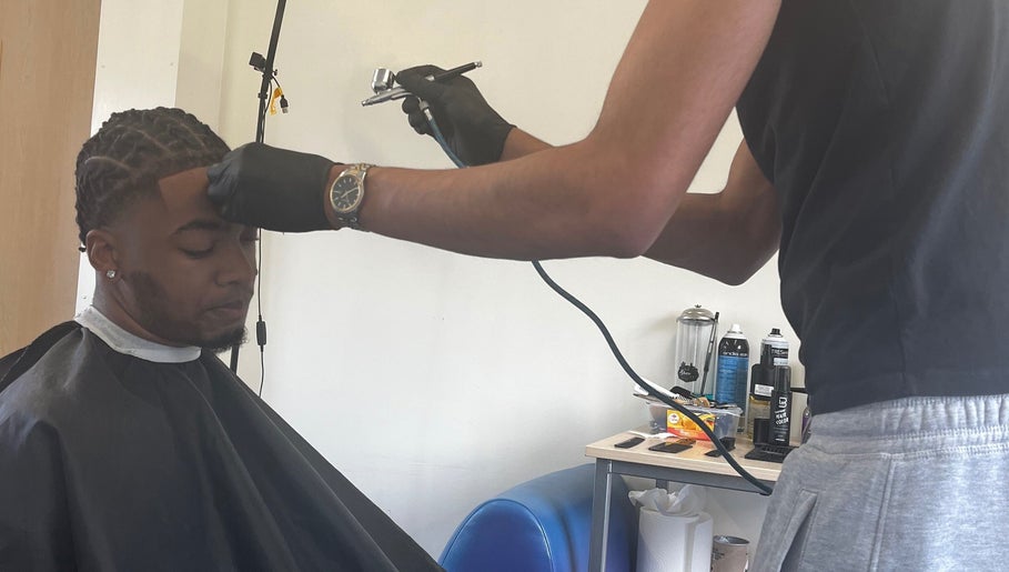 Expert hairstylist at Jujucutthat applies hair treatment, Loughborough, England, GB.