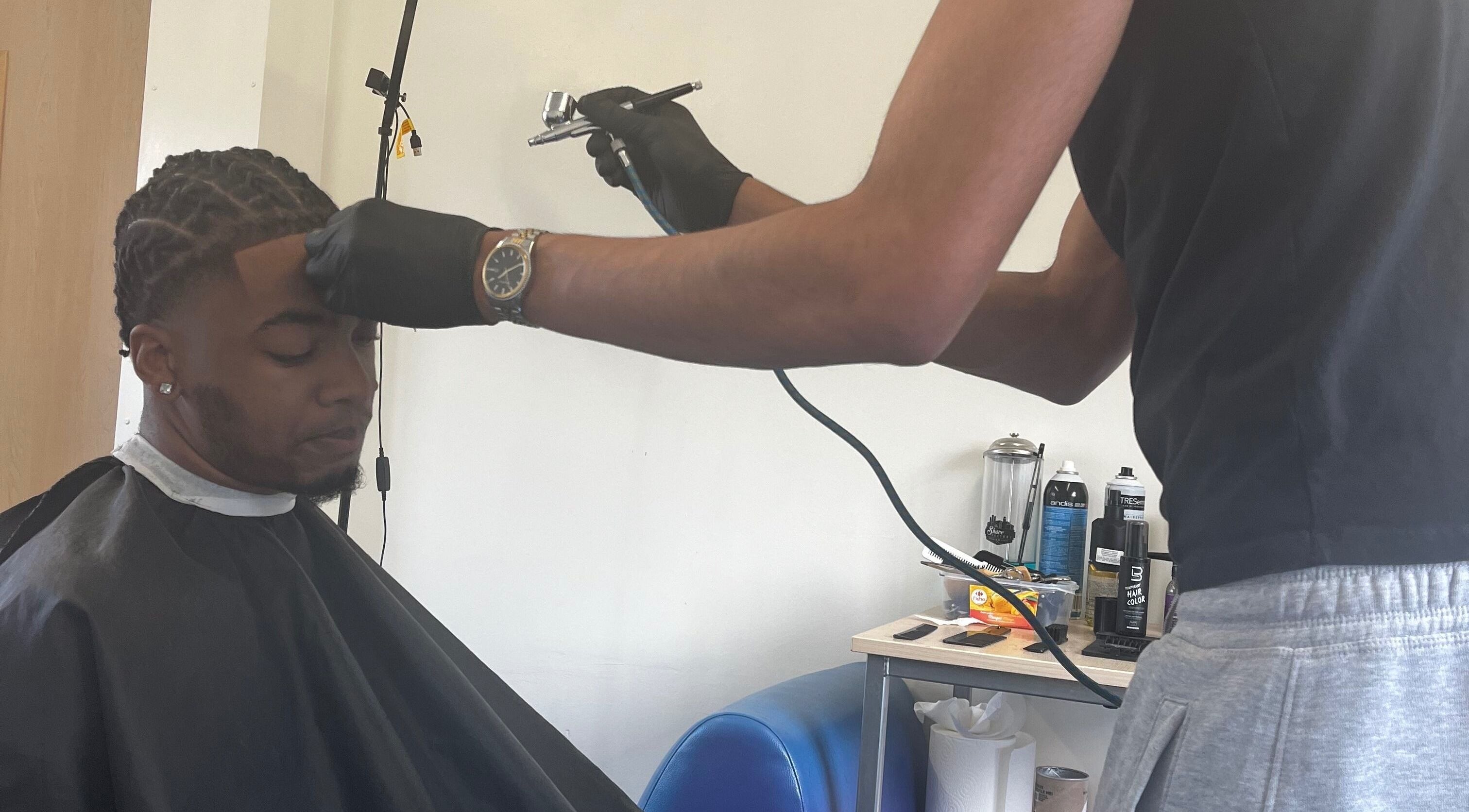 Expert hairstylist at Jujucutthat applies hair treatment, Loughborough, England, GB.