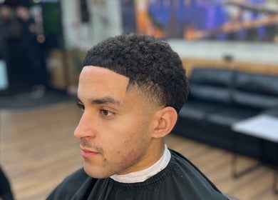 Stylish men's haircut at Jujucutthat, Loughborough, England, GB, showcasing expert grooming.
